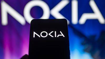 Arjun Kharpal - Nokia jumps 7% as it announces $653 million share buyback program, warns of challenging 2024 - cnbc.com - India - county Mobile