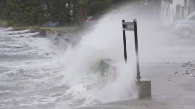 Storm hits Australia with strong winds and power outages, but weakens from cyclone to tropical storm - apnews.com - Australia - state Queensland