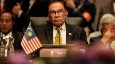 ‘Stop creating problems’ for Anwar, key ally urges Malaysia politicians as unity government instability concerns mount