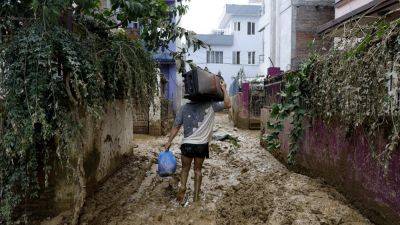 BINAJ GURUBACHARYA - Rescuers search for people still missing in Nepal after flooding and landslides that killed 217 - apnews.com - Nepal - city Kathmandu, Nepal