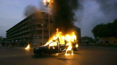 Pakistani police fire tear gas and charge protesters in Karachi