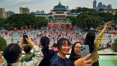 Investors went wild for China during its big holiday. But Chinese shoppers showed little of that optimism