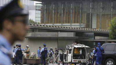 Japan’s ruling party headquarters is attacked with firebombs and suspect is arrested