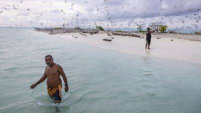 Palau’s vibrant Helen Reef is a magnet for poachers. These rangers keep it safe