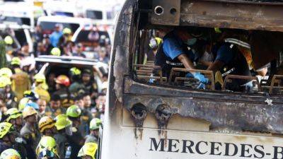 Associated Press - Royal Thailand - Driver who fled Thailand school bus blaze that killed 23 arrested - scmp.com - Thailand - city Bangkok