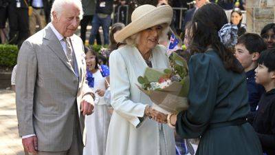 Charles Iii III (Iii) - queen Elizabeth Ii II (Ii) - Children greet King Charles III and Queen Camilla outside a Sydney church - apnews.com - Britain - Australia - county King And Queen