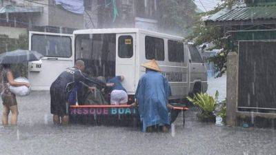 Ferdinand Marcos-Junior - Associated Press - Leni Robredo - Tropical Storm Trami triggers floods in Philippines, trapping some people on roofs - scmp.com - Philippines - city Manila