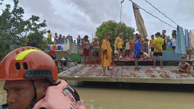 Ferdinand Marcos-Junior - Storm-triggered floods in Philippines spark frantic calls to rescue trapped people, some on roofs - apnews.com - China - Philippines - city Manila, Philippines