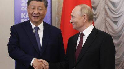 Vladimir Putin - Cyril Ramaphosa - Yuri Ushakov - Putin hosts Global South leaders at BRICS summit meant to counterbalance Western clout - apnews.com - China - Russia - Malaysia - India - South Africa - Ukraine - Iran - Azerbaijan - Uae - Turkey - Saudi Arabia - Egypt - Brazil - Ethiopia - Kazakhstan - county Summit - city Beijing - city Moscow - city Shanghai - city Kazan, Russia