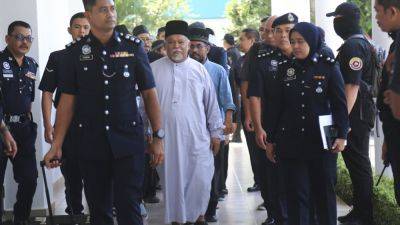 Ashaari Mohamad - Malaysia charges 22 members of an Islamic business group, including its CEO, for organized crime - apnews.com - Malaysia - city Kuala Lumpur, Malaysia