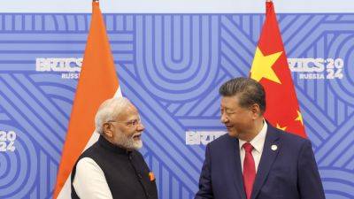 India’s Modi and Chinese President Xi meet days after a border accord between the countries