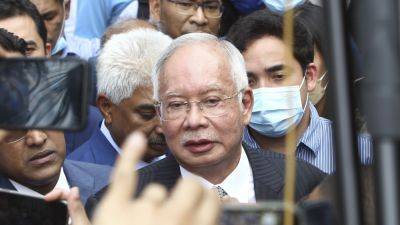 Jailed former Malaysian leader apologizes for fund embezzlement scandal, reiterates his innocence