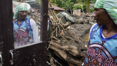 At least 126 dead and missing in massive flooding and landslides in Philippines