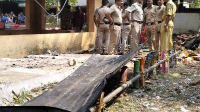 An explosion of fireworks injures more than 150 people at a temple in India