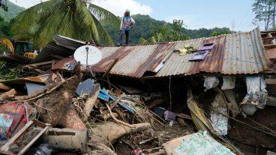 At least 126 dead and missing in massive flooding and landslides in Philippines