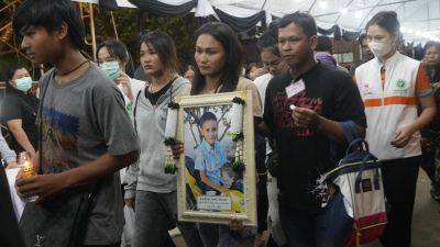 JINTAMAS SAKSORNCHAI - Maha Vajiralongkorn - A small town in central Thailand is mourning the 23 who died in a school bus fire - apnews.com - Thailand - province Thani - city Bangkok