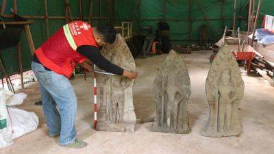 Cambodian archaeologists discover a dozen centuries-old sandstone statues at Angkor UNESCO site