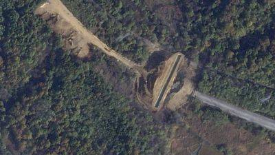 Satellite images show North Korea dug large border trenches after demolishing road, rail links