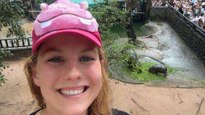 She’s obsessed with baby pygmy hippo Moo Deng. So she flew across the world to see her