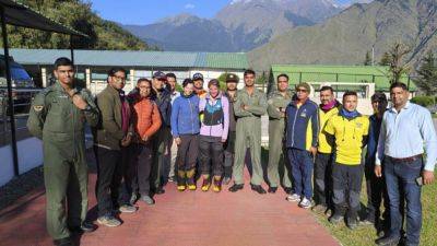 BISWAJEET BANERJEE - 2 foreign climbers rescued after being stranded in India’s Himalayas for 3 days - apnews.com - France - Usa - India - Britain - state Uttarakhand