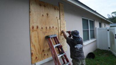 Hurricane Milton is a Category 5. Florida orders evacuations and scrambles to clear Helene's debris