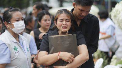 TIAN MACLEOD JI - Small town in Thailand hold mass cremation for 23 who died in a school trip bus fire - apnews.com - Thailand - city Bangkok