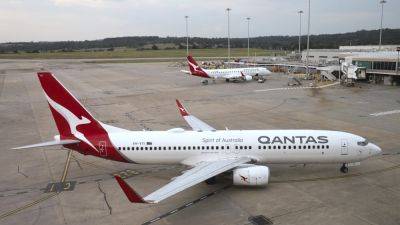 Qantas Airways apologizes after R-rated film reportedly airs on every screen during flight - apnews.com - New York - Australia - city New York