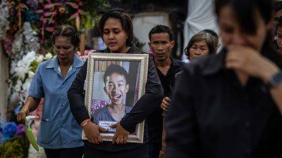 Small town in Thailand holds mass cremation for 23 who died in a school trip bus fire