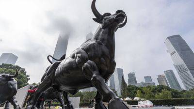 China eases rules for foreign investment in listed companies