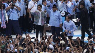 Indonesians join the final campaign events before the presidential election
