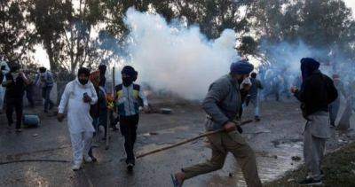 Protesting farmers clash with security forces 200km from New Delhi