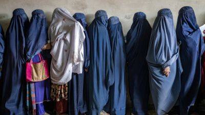 Taliban decrees on clothing and male guardians leave Afghan women scared to go out alone, says UN - apnews.com -  Islamabad - Afghanistan - Qatar