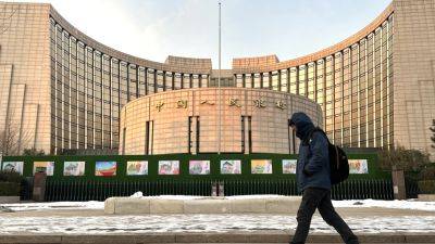 China's central bank leaves key policy rate unchanged under shadow of the Federal Reserve