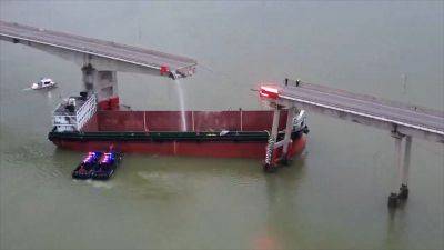 Bridge snaps in half in deadly cargo ship crash