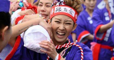 Women take part in Japan's 1,250-year-old 'naked festival' for first time