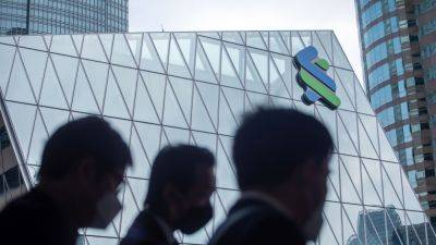 StanChart lowers income target as China weighs, launches $1 billion buyback - cnbc.com - China - Britain