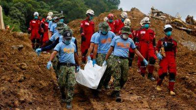 ‘Miracle’: child rescued nearly 60 hours after Philippine landslide