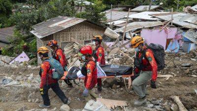 Death toll in landslide-hit Philippine mountain village rises to 11 with more than 100 missing