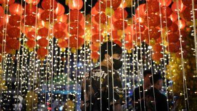 AP PHOTOS: Lunar New Year in the Philippines draws crowds to one of the world’s oldest Chinatowns