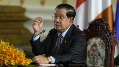 Cambodia’s ruling party claims a leading rights activist defamed it and seeks $500,000 in damages