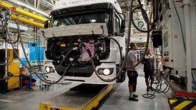Daimler Truck surges 13% to new record on bumper earnings, buyback announcement