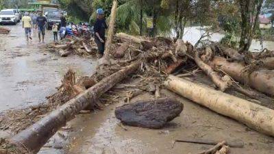 At least 26 dead and 11 missing after flash floods and landslides on Indonesia’s Sumatra island