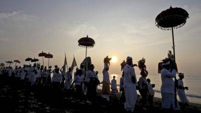 FIRDIA LISNAWATI - AP PHOTOS: Balinese celebrate New Year with firefights, sword-piercing and a sacred Day of Silence - apnews.com - Indonesia
