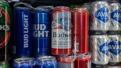 Karen Gilchrist - Budweiser owner AB InBev slides 4% after trading suspension as Altria sells stake - cnbc.com - Belgium