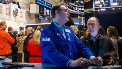 Stock futures edge higher after strong inflation data spooks investors: Live updates