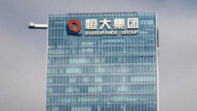 China Evergrande's flagship unit, founder punished for securities fraud