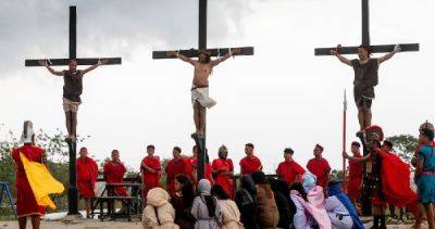 Philippines' Catholic devotees nailed to crosses to re-enact crucifixion