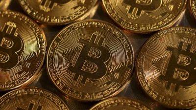 Etf - Bitcoin rockets to record high as investors cheer ETFs, rate prospects - channelnewsasia.com - Usa - Singapore