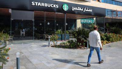 Mideast Starbucks franchisee firing 2,000 workers after being targeted in Israel-Hamas war boycott