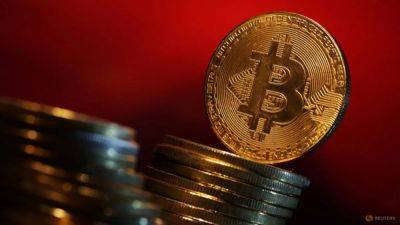 Bitcoin rises to record high over US$70,000